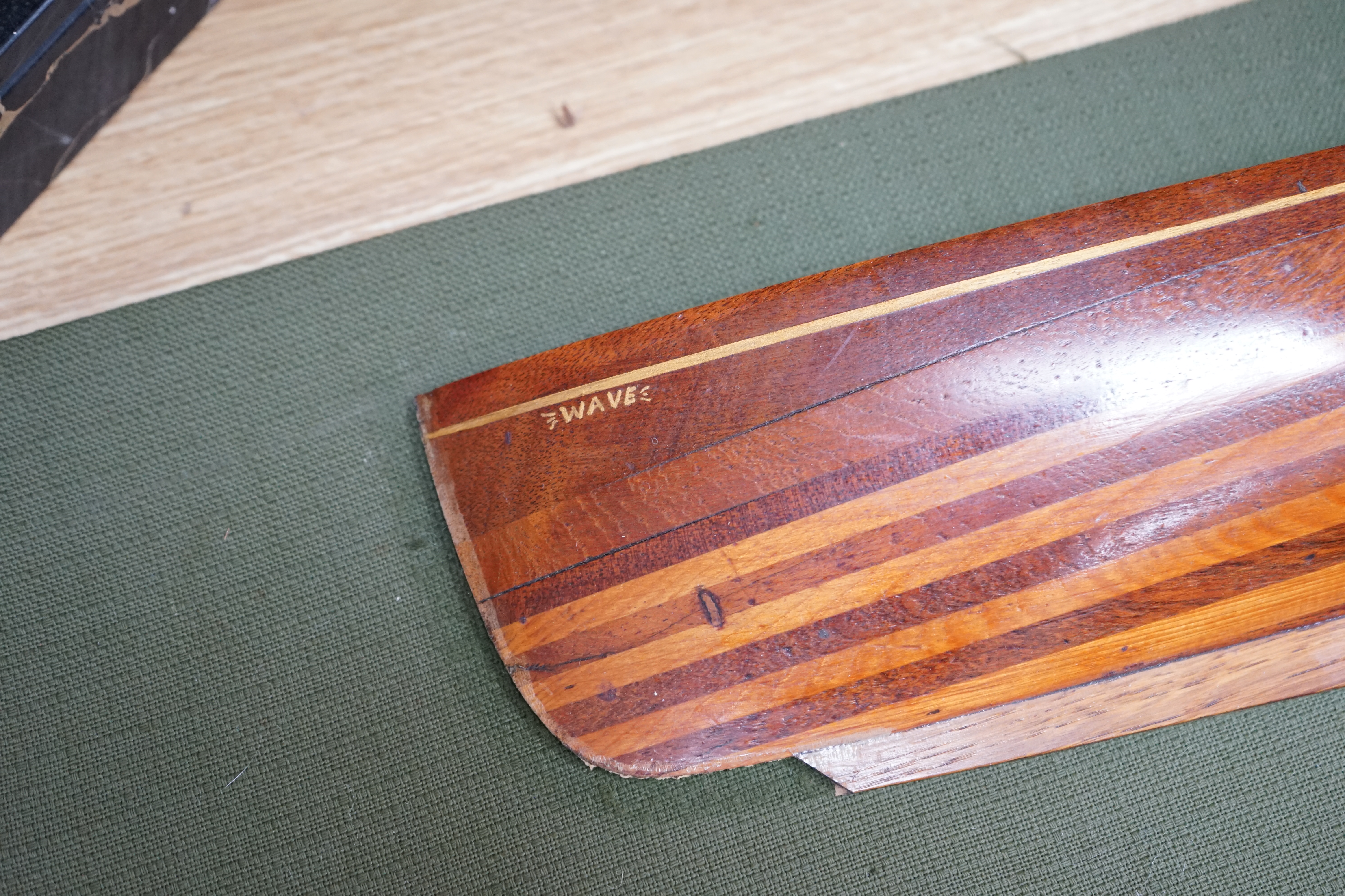 Two mounted cross banded mahogany and yew wood split hull models. Condition - fair to good